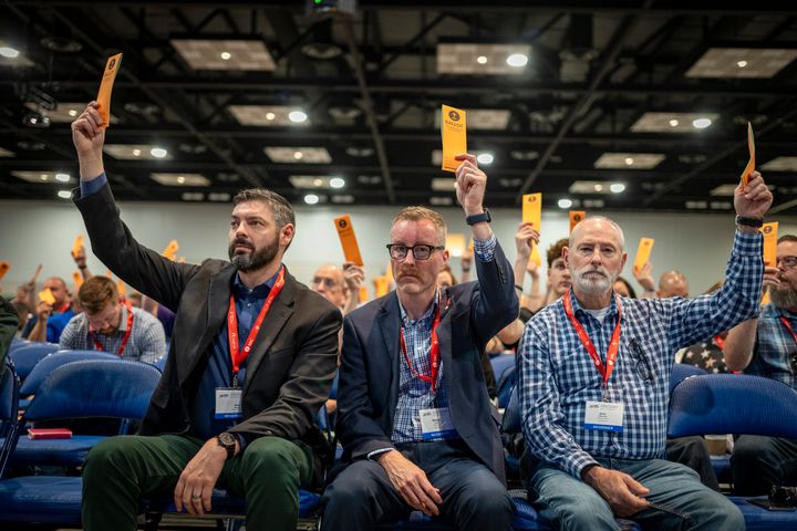 Southern Baptists skew white and conservative. Here, messengers are seen raising their ballots in support of a motion put up for vote at the Indianapolis conference this week.