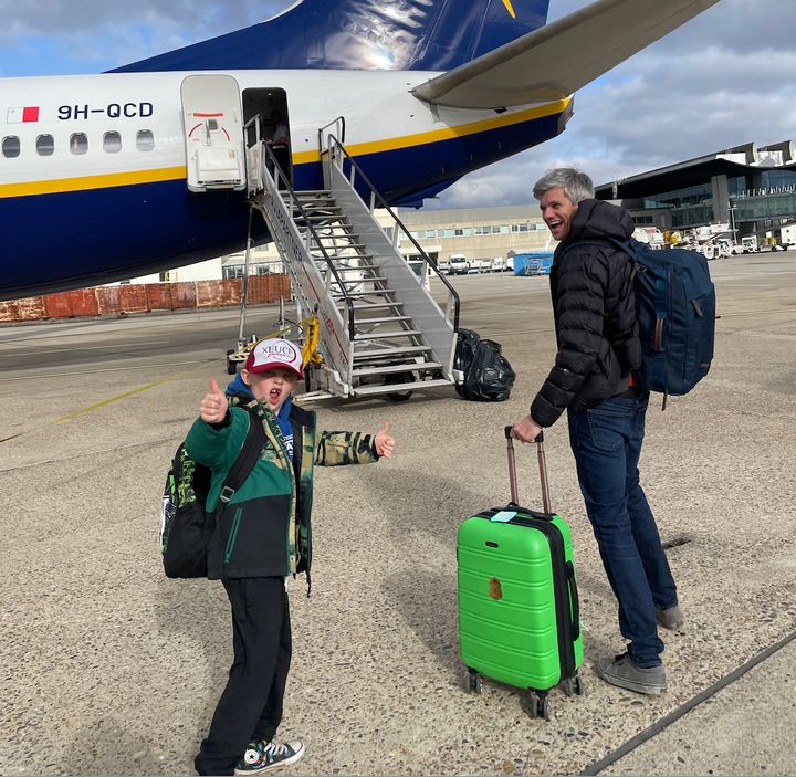 The author's husband and her son board a plane.