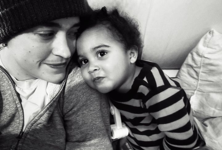 The author and Z, and one of his beloved trucks, cuddling before bed.