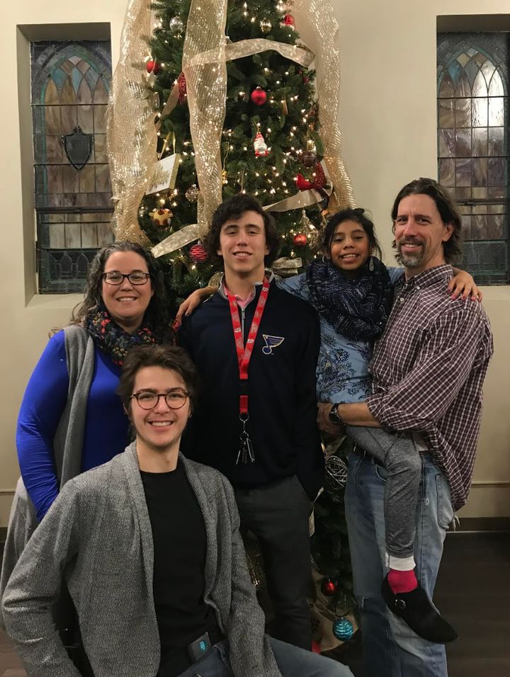 The author (far left), Mitchell (second from left), Mitchell's brother, Maxwell (center), Mitchell's sister, Miranda (second from right), and Mitchell's dad, Matt (far right). "This photo was taken in our church's lobby on Dec. 24, 2018," the author writes. "This was our last family Christmas photo."