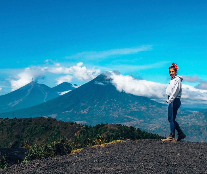 Travel writer Lucy Ruthnum on top of the Pacaya volcano in Guatemala while solo traveling.