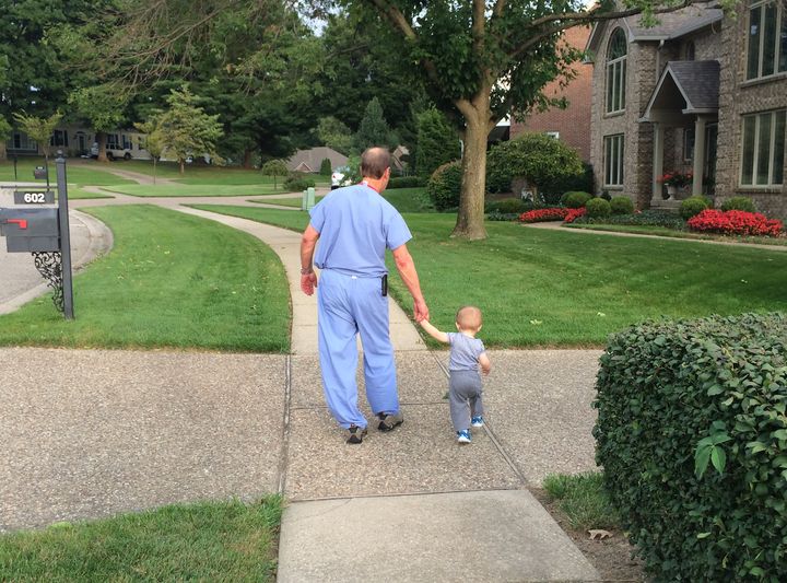 Tonilyn Hornung's father holds her son's hand as they go for a walk.