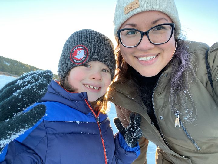 The author poses for a photo with her son.