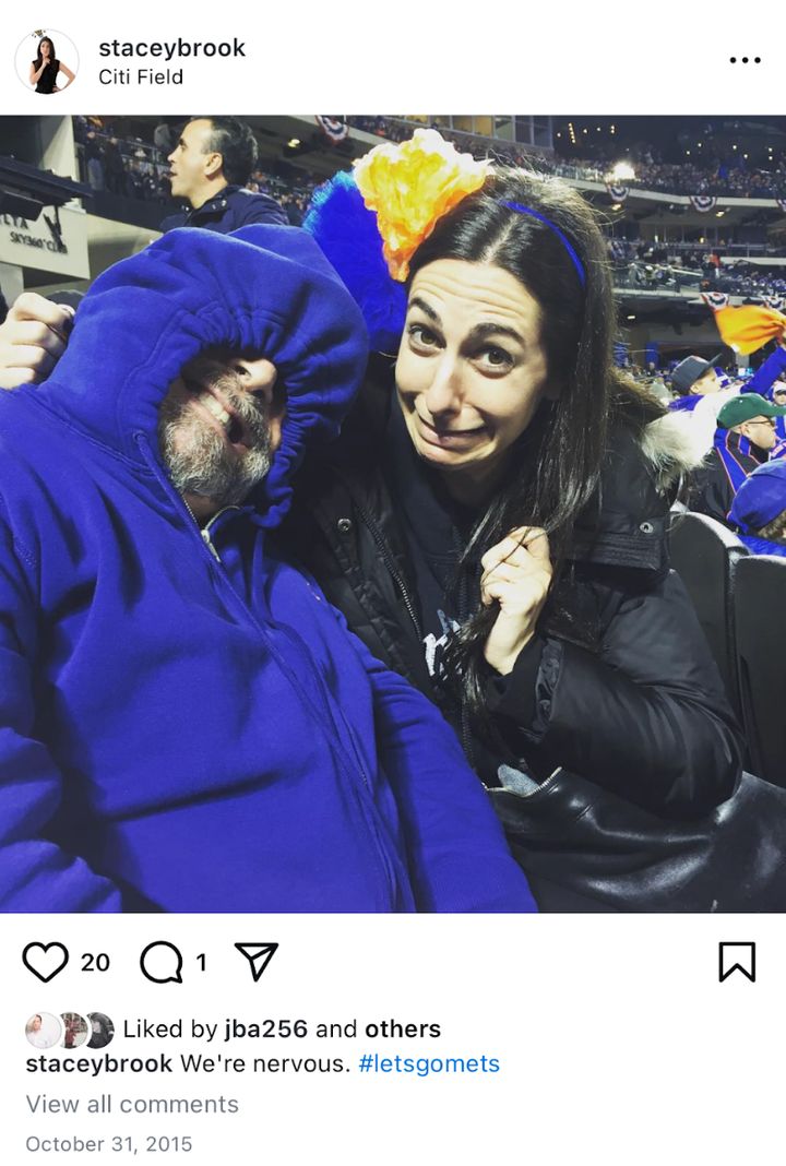 The author and her dad in a "perpetual state of worry" while watching the Mets (lose) in the 2015 World Series.